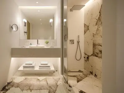 a bathroom with a sink and a mirror at The Roc Club, A Grecotel Hotel to Live in Athens