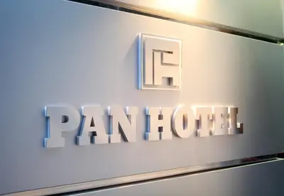 a sign with the word panuth on a wall at Pan Hotel in Athens