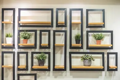 a wall of shelves with potted plants on them at Pame Rentals - Walk Distance To Acropolis with A Charming Design in Athens