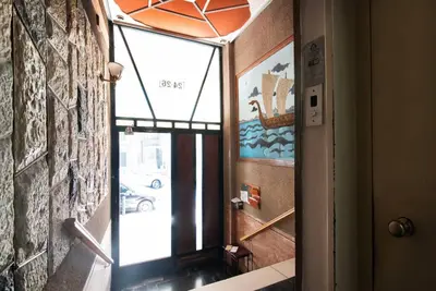 a window in a room with a view of a street at Pame Rentals - Walk Distance To Acropolis with A Charming Design in Athens
