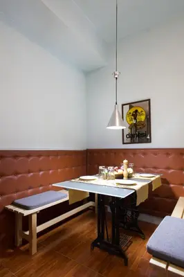 a dining room with a table and a bench at WineSpa Oasis in Athens ! in Athens
