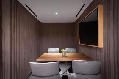 a dining room with a table and chairs and a tv at The Stanley in Athens