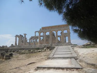 an ancient temple with columns on a hill at Isidora Hotel in Agia Marina Aegina