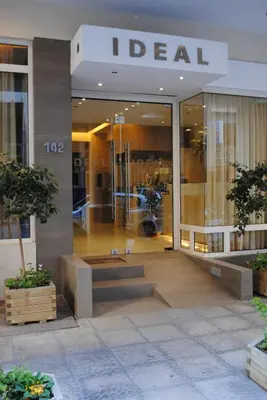 a store front of a dead store with stairs in it at Hotel Ideal in Piraeus