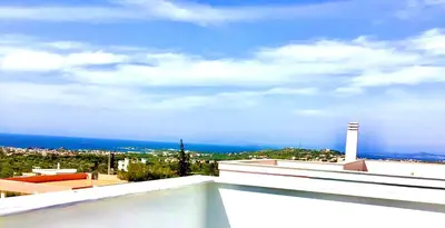 a view of the ocean from the roof of a building at ATHENS RIVIERA Grand Panoramic Villa II Lagonissi in Lagonissi