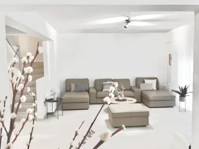 a living room with a couch and a table at ATHENS RIVIERA Grand Panoramic Villa II Lagonissi in Lagonissi
