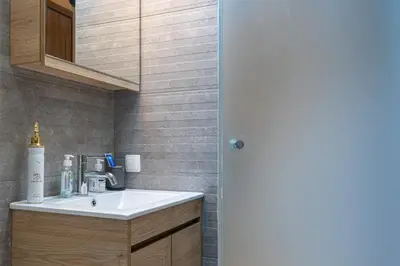 a bathroom with a sink and a mirror at Nikkis Flat - Kolonaki Square in Athens