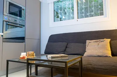 a living room with a couch and a coffee table at Nikkis Flat - Kolonaki Square in Athens
