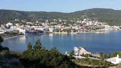 a view of a large body of water with a city at Rachel Hotel in Agia Marina Aegina