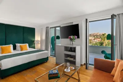 a hotel room with a bed and a large window at Athenaeum Eridanus Luxury Hotel in Athens