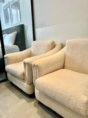 two chairs and a couch in a room with a bed at JV Athens in Athens