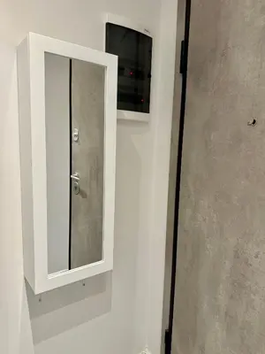 a medicine cabinet with a mirror on a wall at JV Athens in Athens