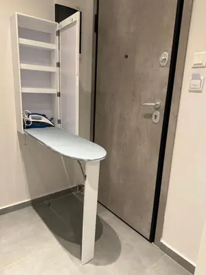 a white bench sitting next to a door at JV Athens in Athens