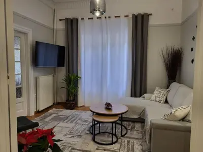a living room with a couch and a table at Plaka Sofi Suite in Athens