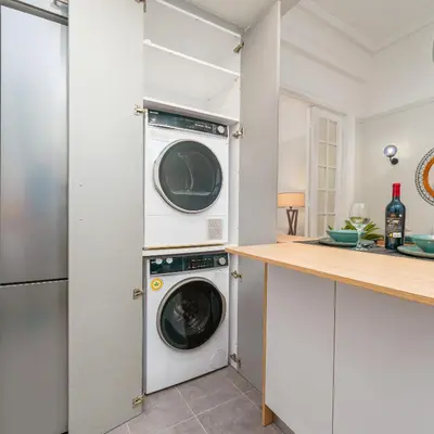 a kitchen with a washer and dryer at Plaka Sofi Suite in Athens