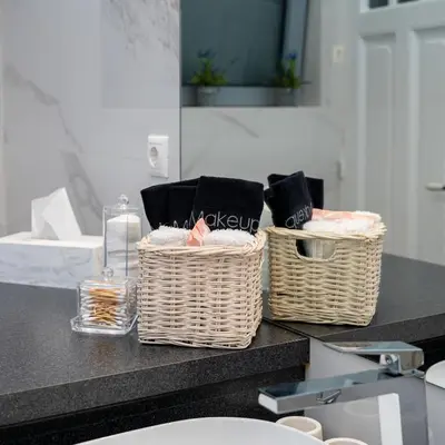 two baskets sitting on a counter in a bathroom at Plaka Sofi Suite in Athens