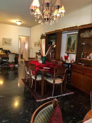 a dining room with a red table and chairs at Spacious Double room in the Center of Athens in Athens