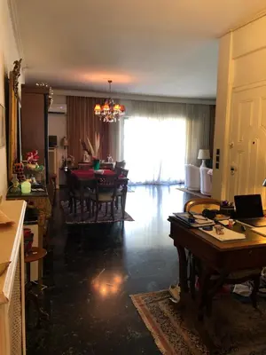 a living room with a table and a dining room at Spacious Double room in the Center of Athens in Athens