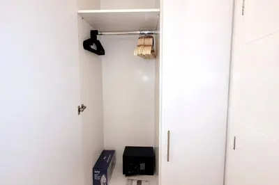 a room with a closet with a door and a box at Acropolis Thisio Apartment 2 bedrooms 2 bathrooms in Athens