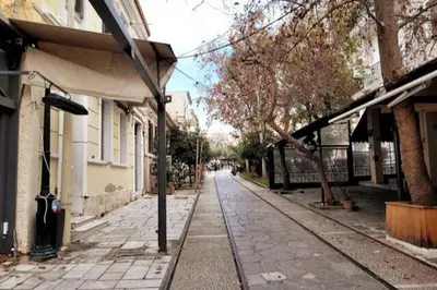 an empty street in a city with buildings at Acropolis Thisio Apartment 2 bedrooms 2 bathrooms in Athens
