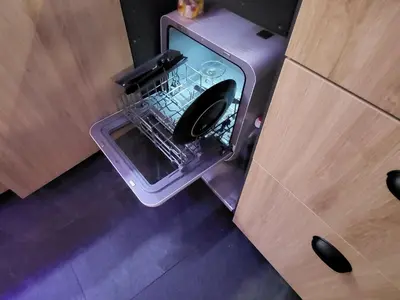 an empty refrigerator with its door open in a kitchen at Agriolykos Luxury layer-Smart home-Athens city center-fully equipped in Athens