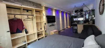 a room with a bed and a room with a bar at Agriolykos Luxury layer-Smart home-Athens city center-fully equipped in Athens