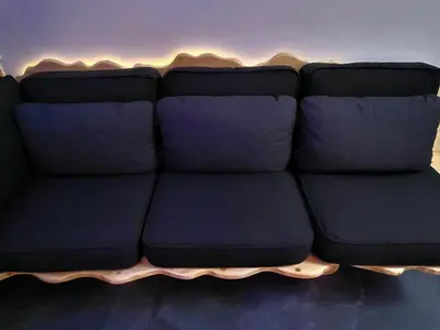 a blue couch sitting in a living room at Agriolykos Luxury layer-Smart home-Athens city center-fully equipped in Athens