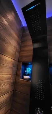 a bathroom with a tub with a television in it at Agriolykos Luxury layer-Smart home-Athens city center-fully equipped in Athens