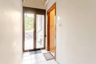 an open door to a room with a balcony at John's Athenian Beauty 45m2 , Metro 7' in Athens