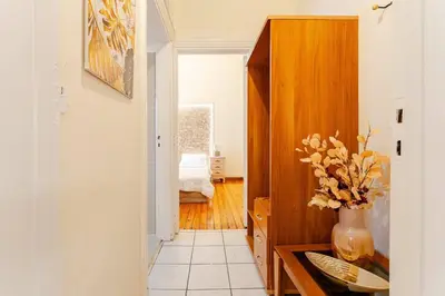a hallway with a vase of flowers on a table at John's Athenian Beauty 45m2 , Metro 7' in Athens