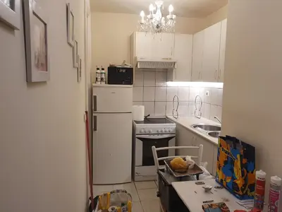 a kitchen with a white refrigerator and a sink at John's Athenian Beauty 45m2 , Metro 7' in Athens