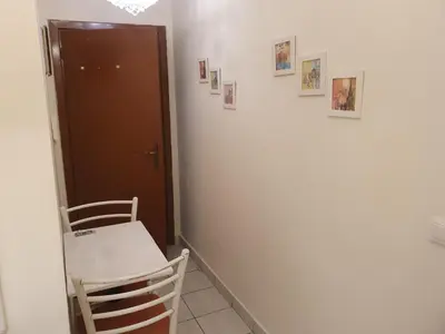a room with a table and two chairs and a door at John's Athenian Beauty 45m2 , Metro 7' in Athens