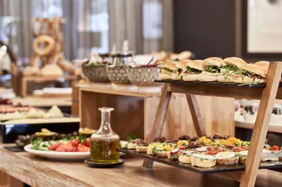 a buffet with sandwiches and other food on display at Sea View Cityscape Hotel in Athens