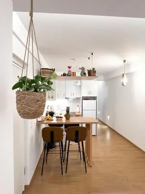 a kitchen and dining room with a table and chairs at Comfy 2 BDR Apt in Petralona - Next to metro in Athens
