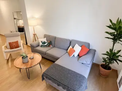 a living room with a couch and a table at Comfy 2 BDR Apt in Petralona - Next to metro in Athens