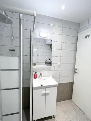 a bathroom with a white sink and a shower at Comfy 2 BDR Apt in Petralona - Next to metro in Athens