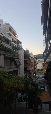 a view of a city street with buildings at A peaceful apartment in Athens in Athens