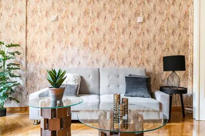a living room with a couch and a glass table at New Huge 5BDR/2bath Apt(+netflix)/1min toAcropolis in Athens