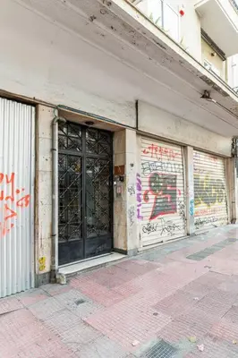 a building with graffiti on the side of it at New Huge 5BDR/2bath Apt(+netflix)/1min toAcropolis in Athens