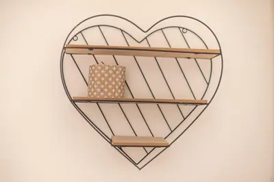a shelf in the shape of a heart at Athens F&K Aphrodite Apartment in Athens