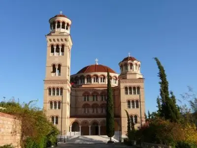 a large building with two towers on top of it at Senia Studios in Agia Marina Aegina