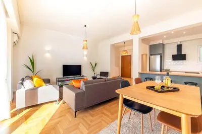 a living room with a couch and a table at Boutique07 Luxury Apartment, Athens, Acropolis. in Athens