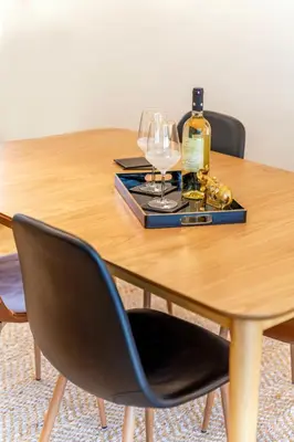 a table with a bottle of wine and glasses on it at Boutique07 Luxury Apartment, Athens, Acropolis. in Athens