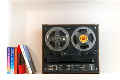 avd player sitting on a shelf next to books at Boutique07 Luxury Apartment, Athens, Acropolis. in Athens