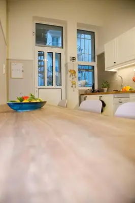 a kitchen with a table with a bowl of fruit on it at Aroura Neoclassical Home 3BR 2BA in Athens