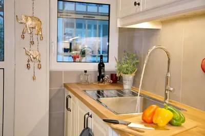 a kitchen counter with a sink and a window at Aroura Neoclassical Home 3BR 2BA in Athens
