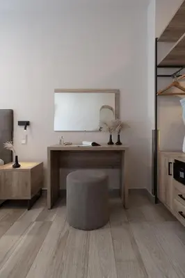 an office with a desk with a chair and a mirror at Piraeus City Hotel in Piraeus