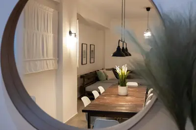 a dining room with a wooden table and chairs at Apartment 7 in Athens