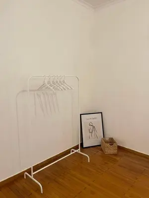 a display case in a room with a picture on the floor at Apartment 7 in Athens