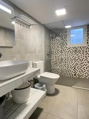 a bathroom with a sink and a toilet at uoohome7 garden one bedroom in Athens